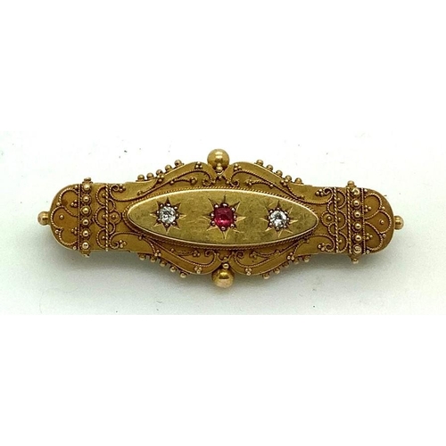 514 - A 19thC 15ct gold brooch set with two diamonds and a pink gem stone, maker N Bs, 5cms l. 5.8gms.