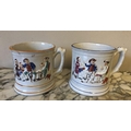 Two large 19thC mugs depicting tavern scenes with frogs to interior, losses to paint and both with h... 