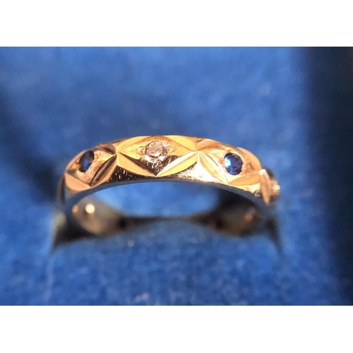 532 - A 9ct gold ring set with blue and white stones. 2.7gms total weight. Size K.