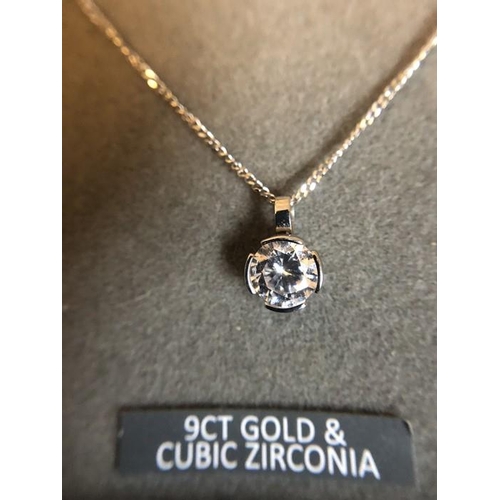 533 - A 9ct white gold chain with cubic zirconia pendant drop. 2.2gms total.