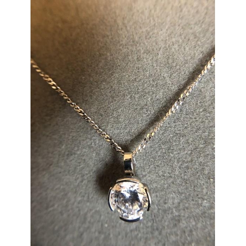 533 - A 9ct white gold chain with cubic zirconia pendant drop. 2.2gms total.