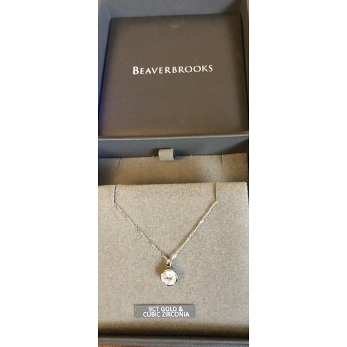 533 - A 9ct white gold chain with cubic zirconia pendant drop. 2.2gms total.