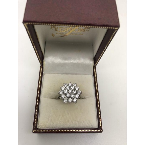 538 - Ladies dress ring CZ set in 18ct white gold. Size L. 5.1gms.