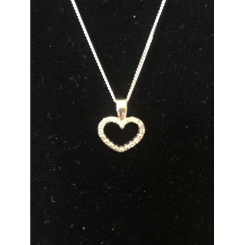 544 - A 9 carat white gold heart pendant set with diamonds and 9 carat white gold bracelet. 5.8 gms in tot... 