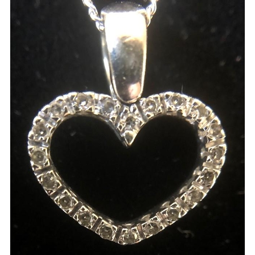 544 - A 9 carat white gold heart pendant set with diamonds and 9 carat white gold bracelet. 5.8 gms in tot... 