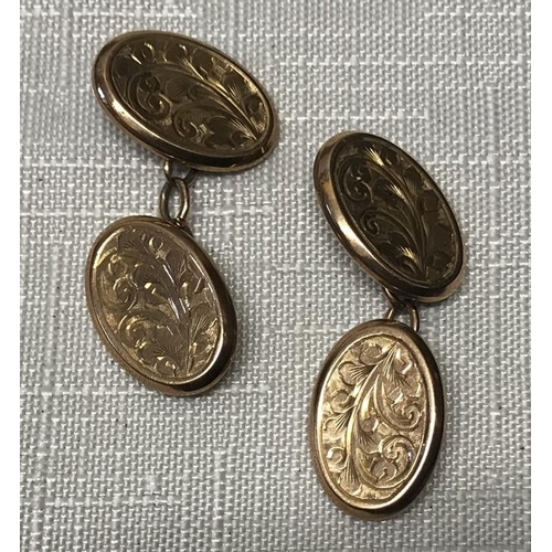 548 - Pair of 9ct gold oval cufflinks, leaf engraved design, 16mm w, 3.5gms.