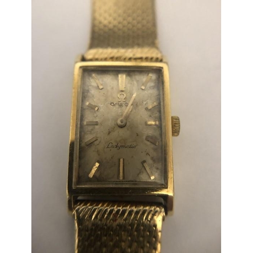 550 - A ladies Omega Ladymatic 18 carat gold wrist watch, total weight 38.9gms.