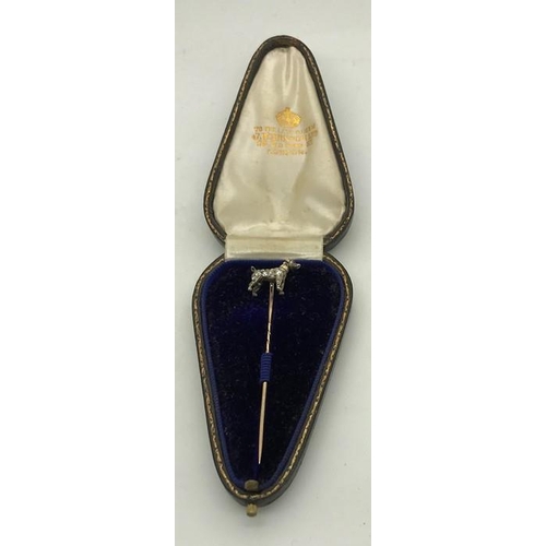 556 - A white and yellow metal dog tie pin set with diamonds in original fitted case. JW Benson Ltd, 25 Ol... 