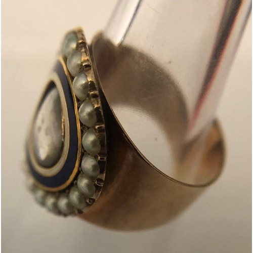 562 - A 19thC mourning ring, hair locket to centre with blue and white enamel surrounded by natural pearl ... 