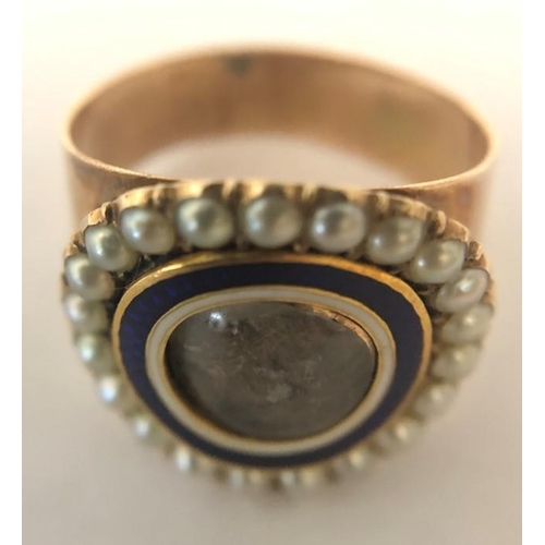 562 - A 19thC mourning ring, hair locket to centre with blue and white enamel surrounded by natural pearl ... 