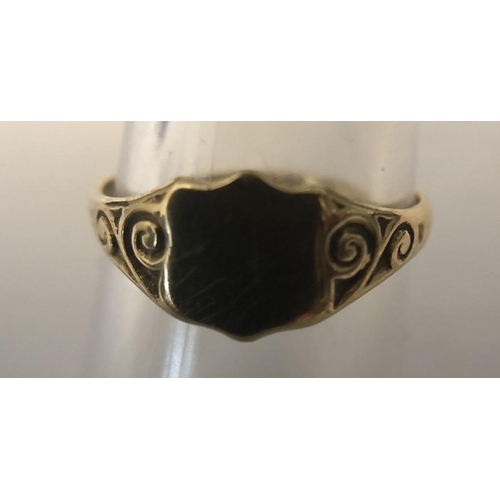 564 - A 9ct yellow gold signet ring, size M, 1.3gms, shield shaped.