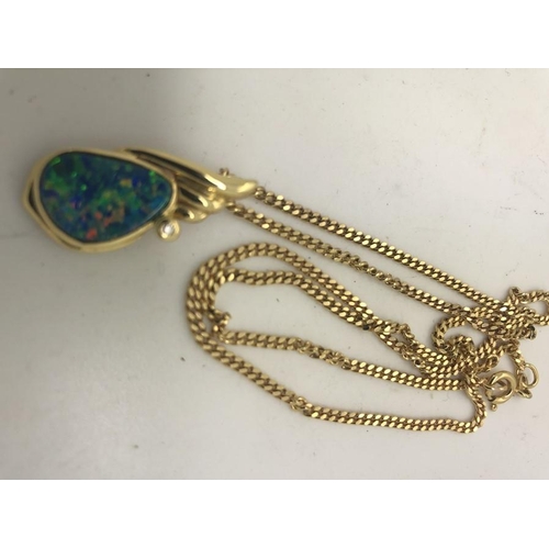 576 - An opal and diamond pendant on 18ct yellow gold on a 9ct flat link chain, 9gms total weight.