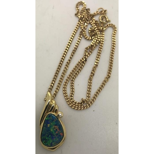 576 - An opal and diamond pendant on 18ct yellow gold on a 9ct flat link chain, 9gms total weight.