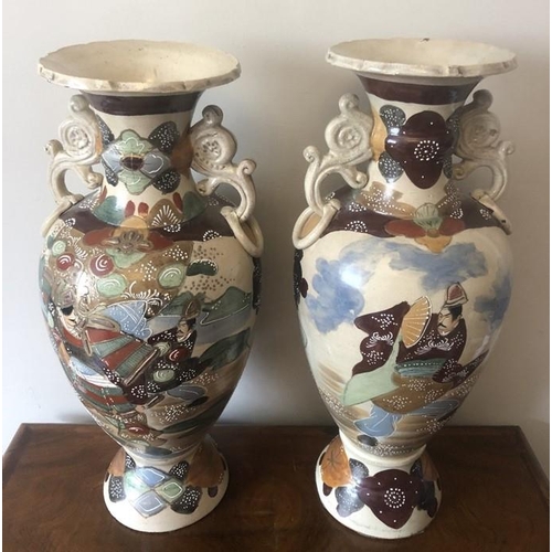 58 - Japanese earthenware vases. 57cms h.