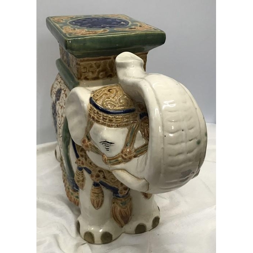 62 - Decorative pottery elephant stool. 38cms h x 52cms l.