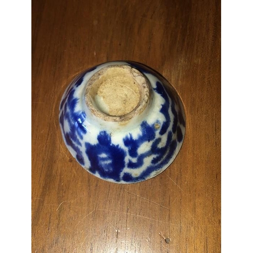 72 - Blue and white ceramic dish 6.5cm d, together with a Roman oil lamp.