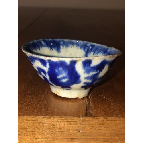 72 - Blue and white ceramic dish 6.5cm d, together with a Roman oil lamp.