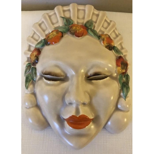 75 - A Clarice Cliff wall pocket face mask, 20cm h.