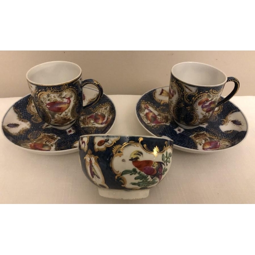 80 - Two coffee cans and saucers and a tea cup scale blue with exotic birds probably Samson late 19th cen... 