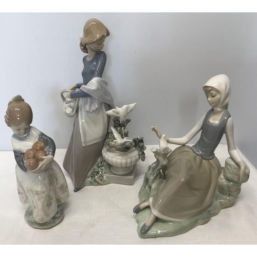 87 - Lladro figurines, girl with flower basket, 25cms h, seated girl with dove, 17cms h and a girl with b... 