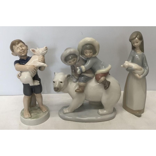 88 - Lladro figurines, Inuit children on a polar bear, 17cms h, young girl with piglet and a Royal Copenh... 