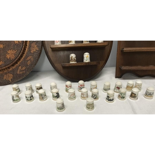 96 - Franklin Porcelain thimble collection with wall mounted display shelves and a wooden poker work circ... 