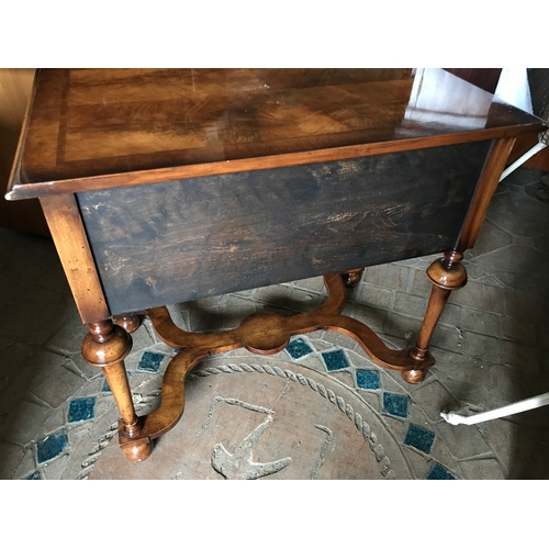 1387 - A good quality walnut reproduction table with cross stretcher base.