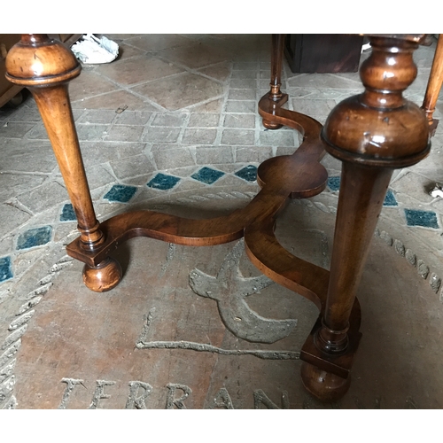 1387 - A good quality walnut reproduction table with cross stretcher base.