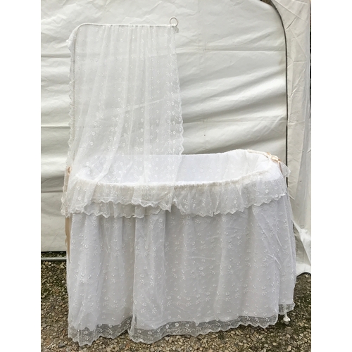 1433A - A late 19th/early 20thC metal swinging crib complete with modern lace drapes. With makers mark photo... 