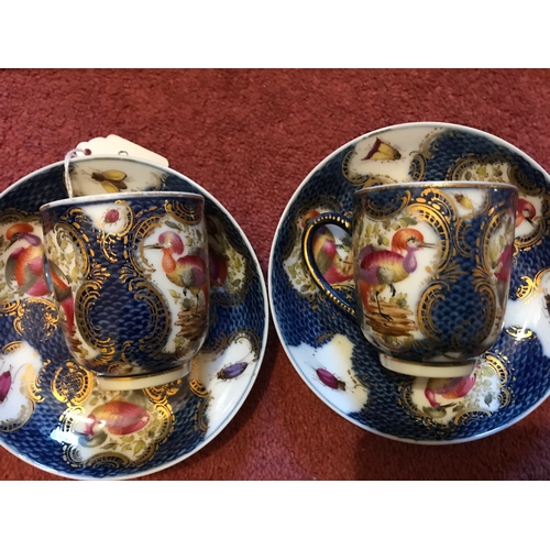 80 - Two coffee cans and saucers and a tea cup scale blue with exotic birds probably Samson late 19th cen... 