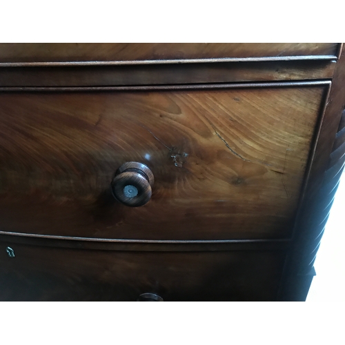 1409 - A 19thC mahogany bowfront chest of drawers, wooden knobs inset with mother of pearl.