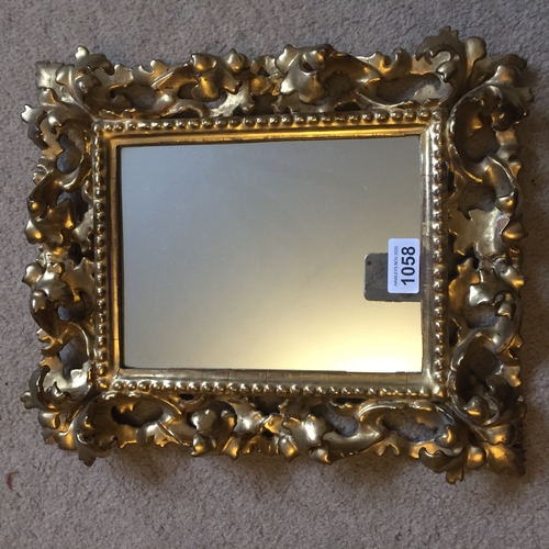 1058 - Finely carved giltwood frame mirror, 37 x 29cms.