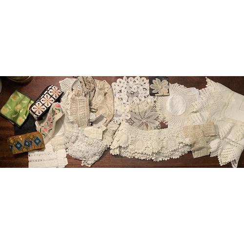 100 - Mainly white linen and crochet edgings with embroidered and silk braid and crochet edged table cloth... 