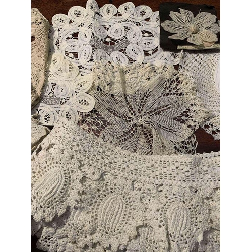 100 - Mainly white linen and crochet edgings with embroidered and silk braid and crochet edged table cloth... 