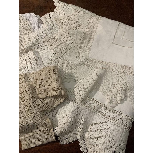 100 - Mainly white linen and crochet edgings with embroidered and silk braid and crochet edged table cloth... 