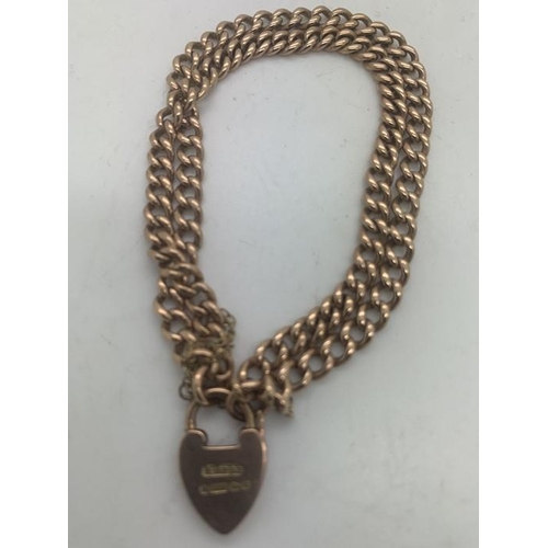 108 - A 9ct gold double chain bracelet with padlock clasp and safety chain. 20.7gms.