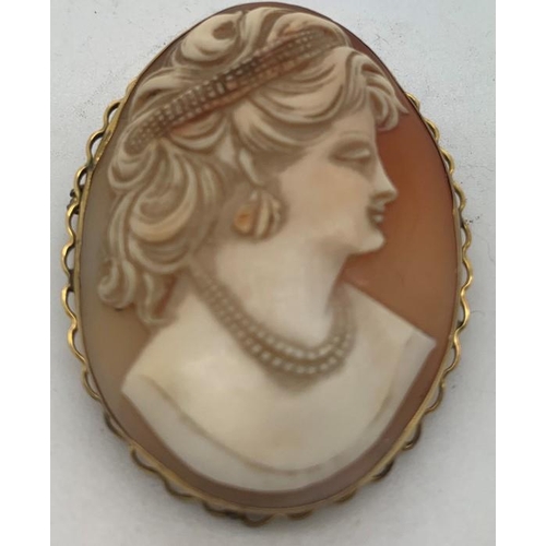 114 - Shell cameo brooch of a female head mounted in 9ct gold, 4.5 x 3.5cms, 11.7gms total weight.