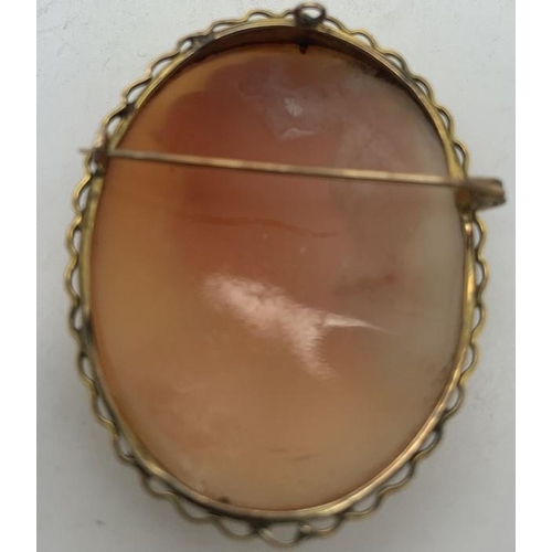 114 - Shell cameo brooch of a female head mounted in 9ct gold, 4.5 x 3.5cms, 11.7gms total weight.