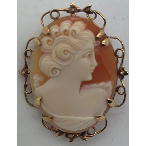 115 - Shell cameo brooch mounted in 9ct gold, 4 x 3.5cms, 8.3gms total weight.