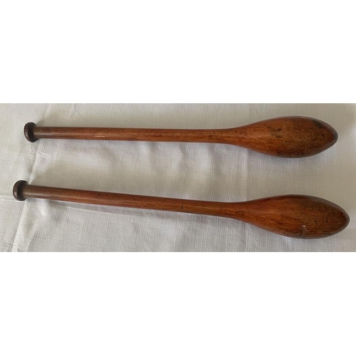 1150 - Two vintage juggling clubs, 50cms long.