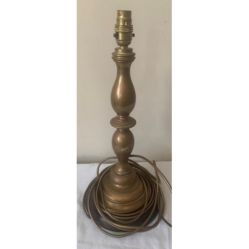 1152 - Brass table lamp. 39cms h. On turned wooden base.