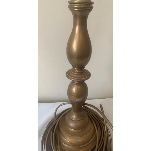 1152 - Brass table lamp. 39cms h. On turned wooden base.