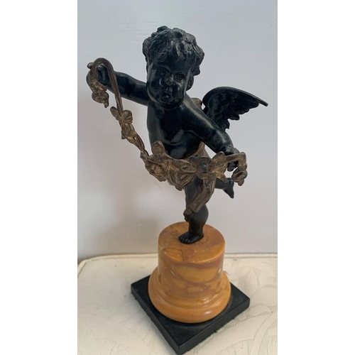 1160 - Bronze winged putto standing on one leg holding garland of flowers, slate base with Sienna marble pl... 