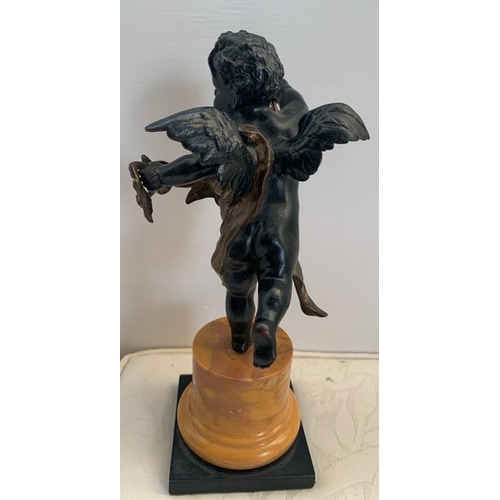 1160 - Bronze winged putto standing on one leg holding garland of flowers, slate base with Sienna marble pl... 