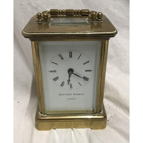 1165 - Brass carriage clock, Matthew Norman London, 11cms h not including handle, 8 w x 7cms d.