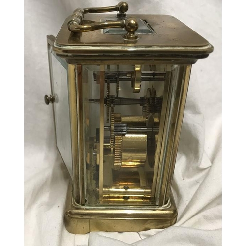 1165 - Brass carriage clock, Matthew Norman London, 11cms h not including handle, 8 w x 7cms d.