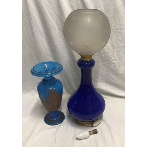 1187 - Blue glass table lamp with frosted engraved globe shade. 57cms h and a blue glass vase with Greek wa... 