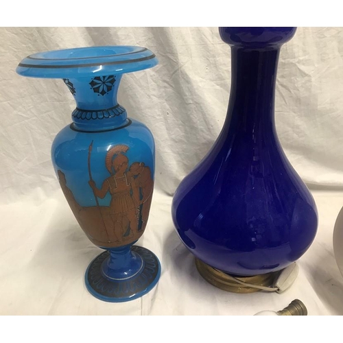 1187 - Blue glass table lamp with frosted engraved globe shade. 57cms h and a blue glass vase with Greek wa... 