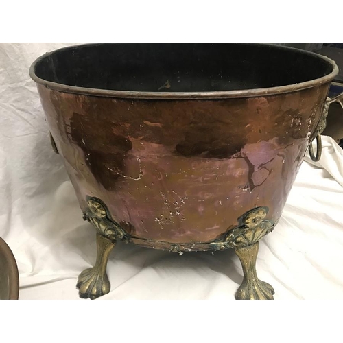 1188 - Copper and brass log bucket with lions head handles and paw feet. Oval shaped 42 w x 31 x 33cms h to... 