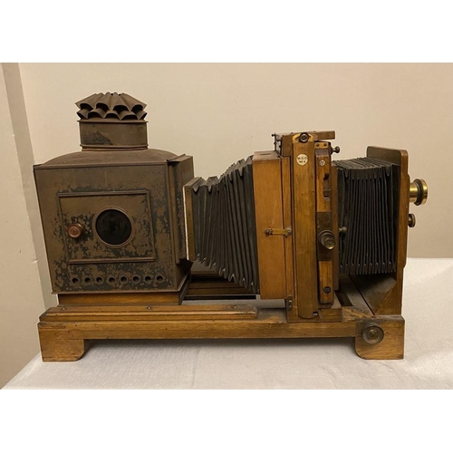 1199 - Thornton Pickard MCC No.6 oak projector with brass lens. 74cms l.